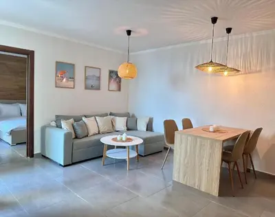 a living room with a couch and a table at Casa Adora in Sozopol