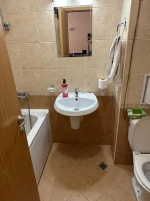 a bathroom with a sink and a tub and a toilet at 2 Room Apartment Royal Sun Sunnybeach in Sunny Beach