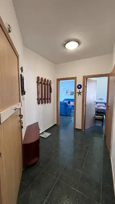 a room with a hallway with a table and a door at Relax in Riviera in Sveti Vlas