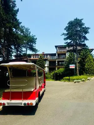 a red and white van parked in a parking lot at Marena Studio - Santa Marina, Sozopol in Sozopol