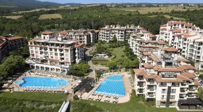 an aerial view of an apartment complex with a swimming pool at Oasis Beach Club - 