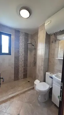 a bathroom with a toilet and a sink at Relax in Kosharica in Kosharitsa