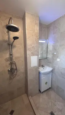 a bathroom with a shower and a toilet and a sink at Relax in Kosharica in Kosharitsa