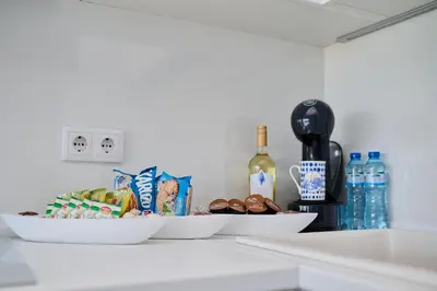 two bowls of food and a bottle of wine on a counter at Sirena Seaview Apartment - FREE PARKING in Varna City