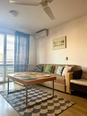 a living room with a couch and a table at Apartment 7 in Sozopol
