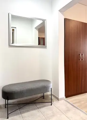 a bench in a room with a mirror at Apartment 7 in Sozopol