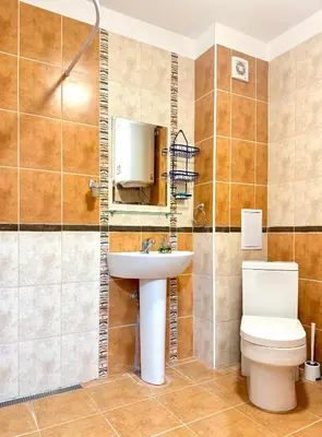 a bathroom with a sink and a toilet at Apartment 7 in Sozopol