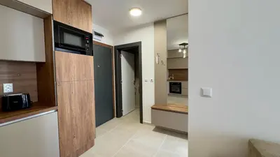 a kitchen with a counter and a microwave in it at Emperium 1 Apartments Sveti Vlas in Sveti Vlas