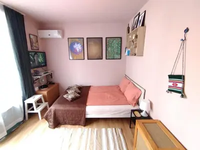 a bedroom with a bed in a room at Cozy studio 150m from the beach in Sveti Vlas