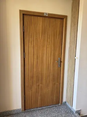 a wooden door in the corner of a room at VP Pacific 2 in Sunny Beach