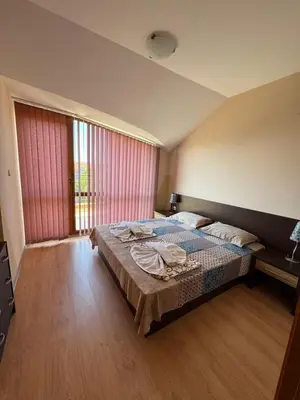 a bedroom with a bed and a large window at VP Pacific 2 in Sunny Beach