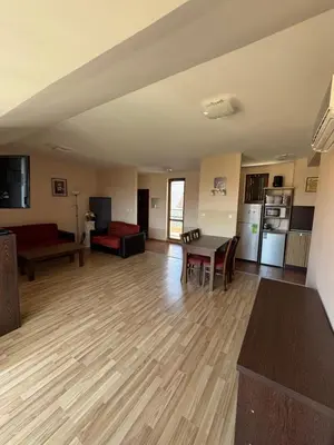 a large living room with a table and a couch at VP Pacific 2 in Sunny Beach