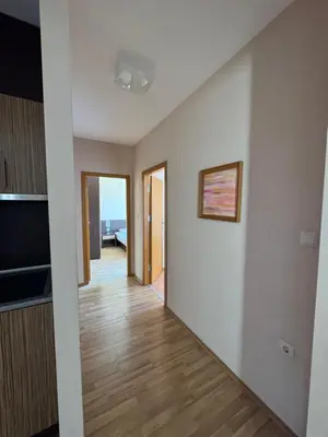 a hallway of a house with white walls and wooden floors at VP Pacific 2 in Sunny Beach
