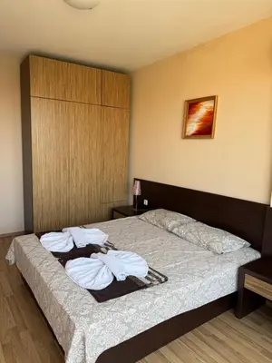 a bedroom with a bed with towels on it at VP Pacific 2 in Sunny Beach
