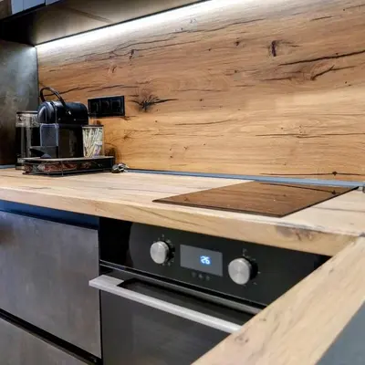 a kitchen with a wooden counter top on a stove at Ika Delux in Burgas City