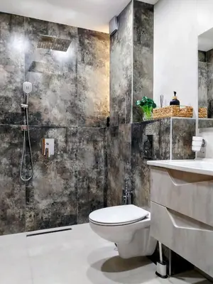 a bathroom with a toilet and a sink at Ika Delux in Burgas City