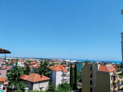 a view of a city with buildings and the ocean at Ika Delux in Burgas City