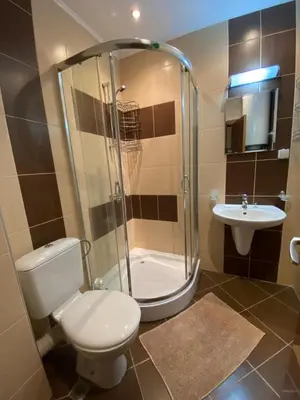 a bathroom with a shower and a toilet and a sink at Marina Park OLIWIA in Sveti Vlas