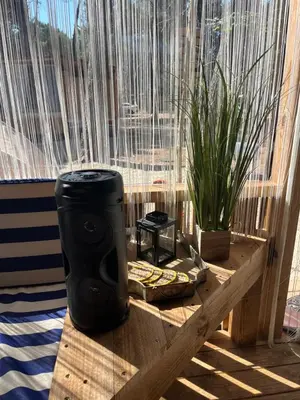 a table in front of a window with a plant at Каравана Coco Bongo in Chernomorets