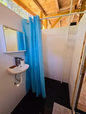 a bathroom with a sink and a shower at Каравана Coco Bongo in Chernomorets