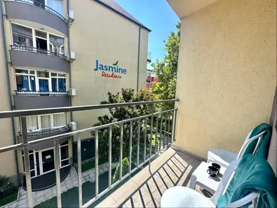 a balcony of a building with a sign on it at Jasmine - Menada Apartments in Sunny Beach