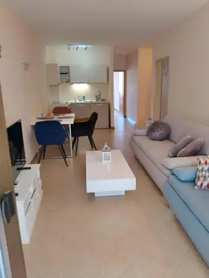 a living room with a couch and a table at 2 Room Apartment with Poolview Royal Sun in Sunny Beach