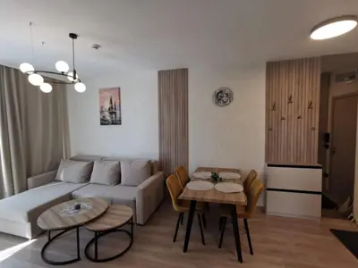a living room with a couch and a table at Sorrento Sole Mare Sveti Vlas in Sveti Vlas