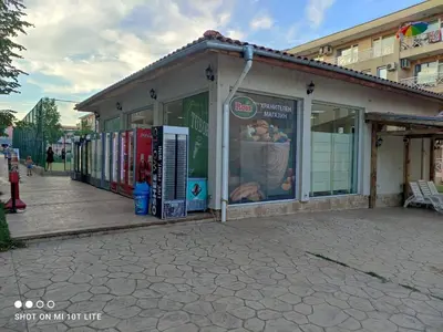 a building with a store front with a lot at Family Studio flat in Tŭnkovo