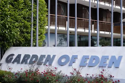 a sign for garden of eden in front of a building at Аpartment in the Garden of Eden in Sveti Vlas