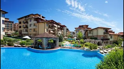 a large swimming pool in front of some buildings at Аpartment in the Garden of Eden in Sveti Vlas