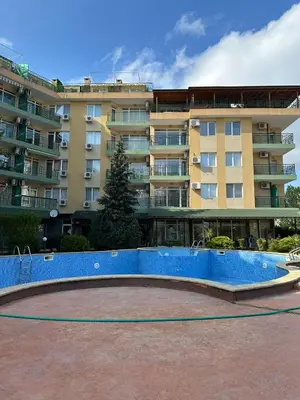 a large apartment building with a large blue wall at Passat12 in Sunny Beach