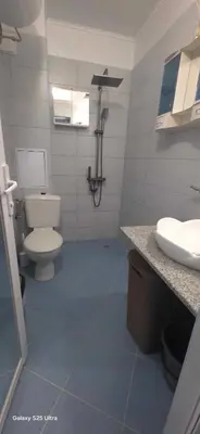 a bathroom with a toilet and a sink at Divine place Pomorie in Pomorie