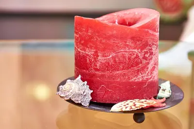 a red cake on a plate with a fish on it at Lazur Studio in Burgas City