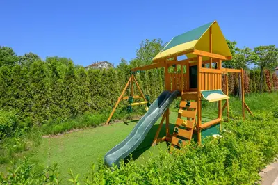 a playground with a slide and a play structure at Azur Properties ap51 in Shkorpilovtsi