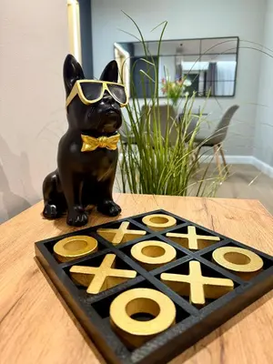 a statue of a dog wearing sunglasses on a table at Апартамент Vista Al Mar in Pomorie