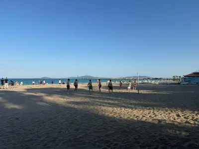 a group of people playing soccer on the beach at Lazzuro 7 in Burgas City
