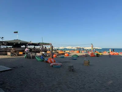 a beach with a bunch of inflatables on the sand at Lazzuro 7 in Burgas City