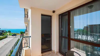 a balcony with a view of the ocean from a building at Sea Holiday 21 in Burgas City