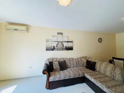 a couch in a living room with a picture on the wall at KALIA C2 Two Bedroom Apartment Sunny Beach in Sunny Beach