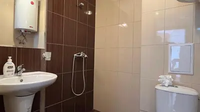 a bathroom with a shower and a sink and a toilet at ASTORIA II Apartment 54 One Bedroom in Elenite