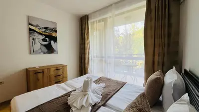 a bedroom with a bed and a large window at ASTORIA II Apartment 24 One Bedroom in Elenite