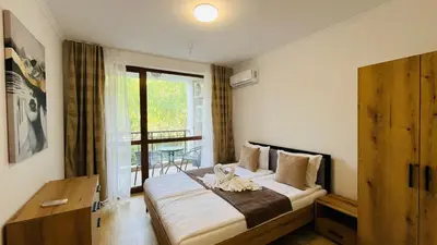 a bedroom with a bed with a cat on it at ASTORIA II Apartment 24 One Bedroom in Elenite