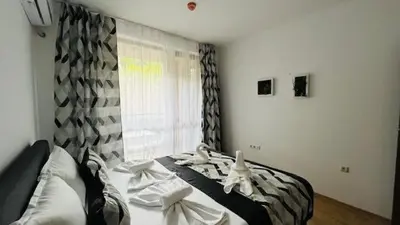 a bedroom with a bed with white towels on it at ASTORIA II Apartment 23 One Bedroom in Elenite