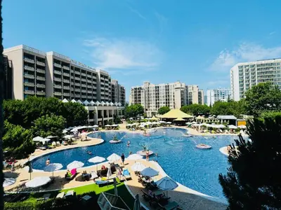 a large swimming pool with people in a city at Royal Barcelo G404 Sunny Beach in Sunny Beach