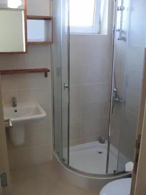 a bathroom with a shower and a sink at High in the Sky Apartments in Sozopol