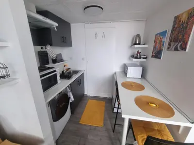 a small kitchen with two sinks and a counter at Roman panorama - Varna in Varna City