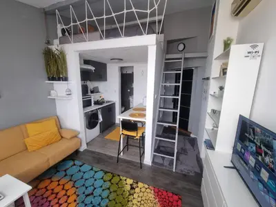 a living room with a couch and a table at Roman panorama - Varna in Varna City