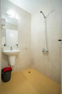 a bathroom with a sink and a shower at Harmani Haven 1BD Apartment with Own Parking spot by Flat Manаger in Sozopol