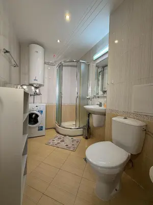 a bathroom with a toilet and a sink and a shower at Sky dreams Sveti Vlas in Sveti Vlas
