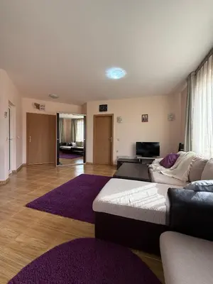 a living room with a couch and a purple rug at Sky dreams Sveti Vlas in Sveti Vlas